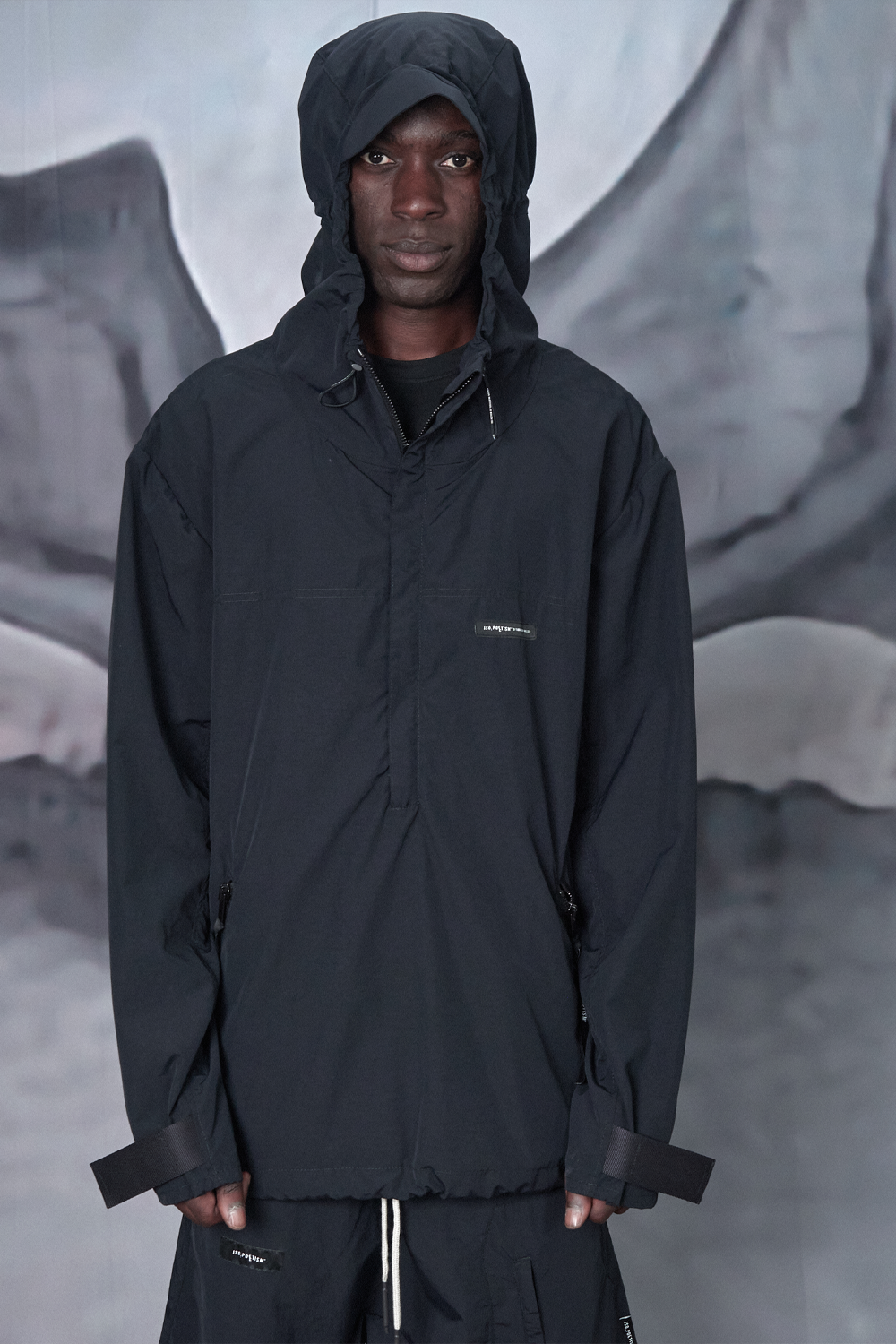 Buy the Iso Poetism Amera Half-Zipped Hooded Anorak W/ Pocket in Black at Intro. Spend £100 for free UK delivery. Official stockists. We ship worldwide.